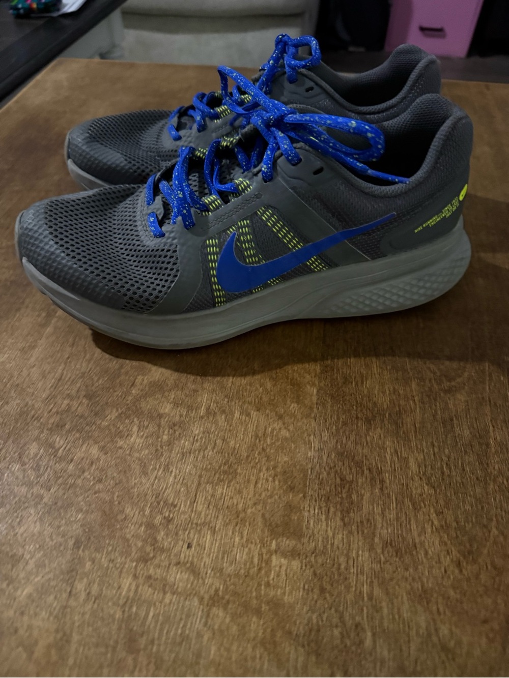 Nike Men's Gray Athletic Shoes with Blue Swoosh and Laces